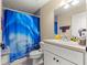 Bathroom showcasing a vanity with blue mountain scene shower curtain at 1553 Ne 161St Pl, Citra, FL 32113