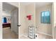Bathroom features a small vanity, toilet, storage cabinet, and small window at 1553 Ne 161St Pl, Citra, FL 32113