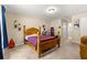 Cozy bedroom with a full bed, carpeted floors, and neutral paint, and easy access to ensuite bathroom at 1553 Ne 161St Pl, Citra, FL 32113