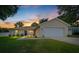 Charming single-story home boasting a manicured lawn, and a spacious two-car garage at 1553 Ne 161St Pl, Citra, FL 32113