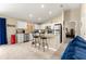 Open kitchen with stainless appliances, tile backsplash, and breakfast bar with seating at 1553 Ne 161St Pl, Citra, FL 32113