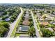 Inviting home with mature landscaping, nestled among tree-lined streets and well-maintained lawns at 1584 Silhouette Dr, Clermont, FL 34711