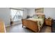 Cozy bedroom with luxury vinyl plank floors, natural lighting and a relaxing decor at 1584 Silhouette Dr, Clermont, FL 34711