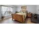 Comfortable bedroom features luxury vinyl plank flooring, a large window, and an exotic accent at 1584 Silhouette Dr, Clermont, FL 34711