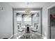 Cozy breakfast nook featuring a bay window with natural light and modern chandelier at 1584 Silhouette Dr, Clermont, FL 34711
