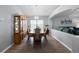 Traditional dining room with wood furniture, elegant chandelier, and open-concept design at 1584 Silhouette Dr, Clermont, FL 34711