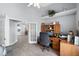 Bright home office featuring luxury vinyl plank flooring, built-in shelving, and lots of natural light at 1584 Silhouette Dr, Clermont, FL 34711