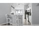 Well-designed kitchen featuring bar seating, sleek appliances, and a breakfast nook at 1584 Silhouette Dr, Clermont, FL 34711