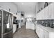Bright kitchen with white cabinetry, stainless steel appliances, and granite countertops at 1584 Silhouette Dr, Clermont, FL 34711
