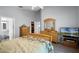 Bright main bedroom with a relaxing decor, luxury vinyl plank floors and a view of the bathroom at 1584 Silhouette Dr, Clermont, FL 34711