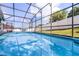 Screened-in pool area with a clear view of a fenced yard at 1584 Silhouette Dr, Clermont, FL 34711