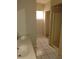 Functional bathroom featuring a double vanity, tile floors and a step-in shower at 2426 Maple Ave, Sanford, FL 32771
