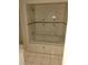 A well-lit bathroom featuring a tub with tile surround and built-in fixtures at 2426 Maple Ave, Sanford, FL 32771