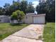 Charming single-story home with a well-maintained lawn and a one-car garage at 2426 Maple Ave, Sanford, FL 32771