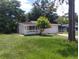 Inviting single-story home featuring a front porch and a one-car garage at 2426 Maple Ave, Sanford, FL 32771
