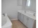 Modern bathroom featuring double sinks and a large soaking tub at 3223 Sw 41St Ave, Ocala, FL 34474