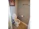 Bathroom with neutral tones, ceramic flooring and a white commode at 3223 Sw 41St Ave, Ocala, FL 34474