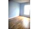 Bright bedroom with laminate flooring and a large sunny window at 3223 Sw 41St Ave, Ocala, FL 34474