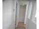 Bright hallway features white walls, an archway and laminate floors at 3223 Sw 41St Ave, Ocala, FL 34474