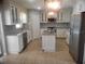 Stylish kitchen with white cabinets, granite countertops, and stainless steel appliances at 3223 Sw 41St Ave, Ocala, FL 34474