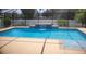 Screened-in pool with a tile waterfall feature at 3223 Sw 41St Ave, Ocala, FL 34474