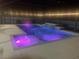 Night view of a stunning pool with lights and water feature, creating a relaxing outdoor oasis at 3223 Sw 41St Ave, Ocala, FL 34474
