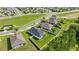 Aerial view of a community featuring neatly planned homes, well-manicured lawns, and mature trees at 358 Irving Bend Dr, Groveland, FL 34736