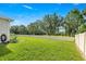 Lush backyard with a privacy fence offering ample space for outdoor enjoyment at 358 Irving Bend Dr, Groveland, FL 34736