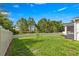 Expansive backyard is fully fenced for privacy, with plenty of space for outdoor activities at 358 Irving Bend Dr, Groveland, FL 34736