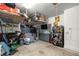 Functional garage with organized storage, shelving, and a tool storage unit at 358 Irving Bend Dr, Groveland, FL 34736
