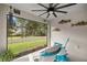 Cozy lanai featuring outdoor seating, decorative fish, and a serene view of the backyard at 358 Irving Bend Dr, Groveland, FL 34736