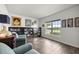 Bright living room featuring a large window and elegant built-in bookcases at 358 Irving Bend Dr, Groveland, FL 34736