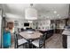 Open concept living room featuring a large kitchen island, a dining area, and modern furniture at 358 Irving Bend Dr, Groveland, FL 34736
