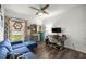 Inviting office area with blue sofa and well-lit work space at 358 Irving Bend Dr, Groveland, FL 34736