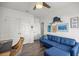 Bright office featuring comfortable blue couch, ceiling fan and closet at 358 Irving Bend Dr, Groveland, FL 34736