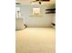 Carpeted living area featuring cozy carpeting and natural light, perfect for comfortable living at 3610 Sw 25Th Pl, Ocala, FL 34474