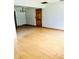 Spacious living area featuring hardwood floors and tile flooring, perfect for entertaining guests at 3610 Sw 25Th Pl, Ocala, FL 34474