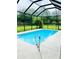 Enjoy the outdoors with this in-ground pool inside a screened enclosure at 3610 Sw 25Th Pl, Ocala, FL 34474
