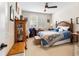 Comfortable bedroom with a ceiling fan, ample natural light, and a bed, creating a serene retreat at 4232 Nw 56Th Ct, Ocala, FL 34482