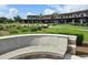 Exterior view of the clubhouse with outdoor seating and well-maintained landscaping at 4232 Nw 56Th Ct, Ocala, FL 34482