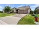 Charming one-story home with a well-maintained lawn and a two-car garage at 4232 Nw 56Th Ct, Ocala, FL 34482
