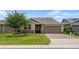Charming home featuring a well-manicured lawn and a two-car garage at 4232 Nw 56Th Ct, Ocala, FL 34482