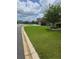 Street view of a well-maintained home with a lush green lawn and mature landscaping at 4232 Nw 56Th Ct, Ocala, FL 34482