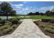 Scenic view of a beautifully landscaped golf course with a paved walkway at 4232 Nw 56Th Ct, Ocala, FL 34482