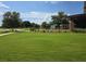 Expansive green space with golf course views and an decorative equine statue at 4232 Nw 56Th Ct, Ocala, FL 34482