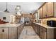 The gourmet kitchen offers stone countertops, stainless appliances, and designer finishes at 4232 Nw 56Th Ct, Ocala, FL 34482