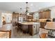 The kitchen offers a center island, stainless appliances, and stone countertops at 4232 Nw 56Th Ct, Ocala, FL 34482