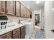 Well-equipped laundry room featuring front-load washer/dryer, lots of cabinetry and a laundry counter at 4232 Nw 56Th Ct, Ocala, FL 34482