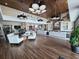 Spacious lounge area with comfortable seating, hardwood floors, and decorative lighting at 4232 Nw 56Th Ct, Ocala, FL 34482