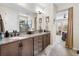 Main bathroom features double sinks with granite countertops and leads to the main bedroom at 4232 Nw 56Th Ct, Ocala, FL 34482